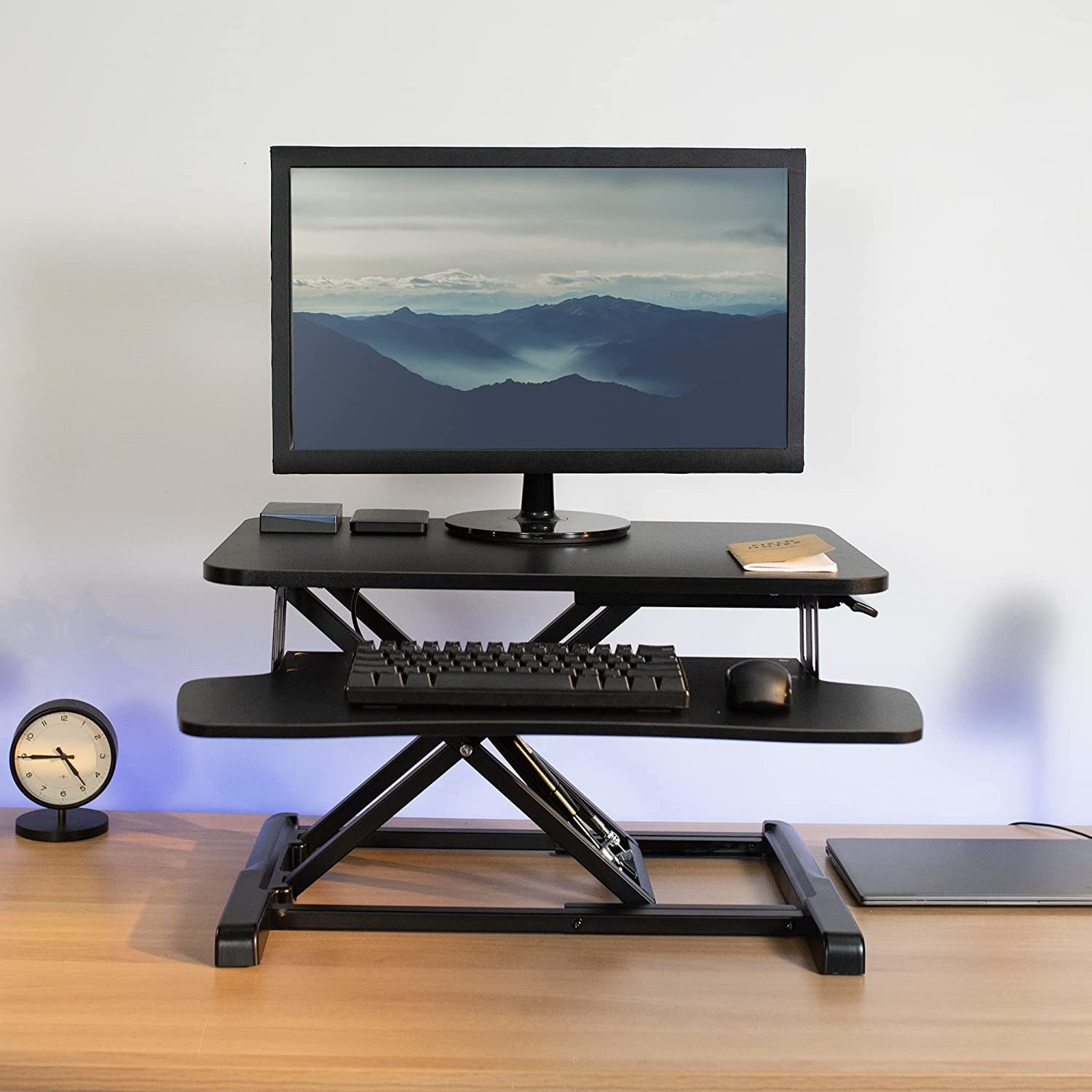 a standing desk attachment on a desk