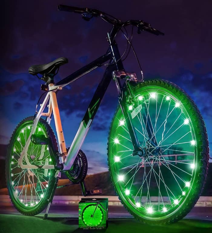 a bike with colourful lights on both wheels