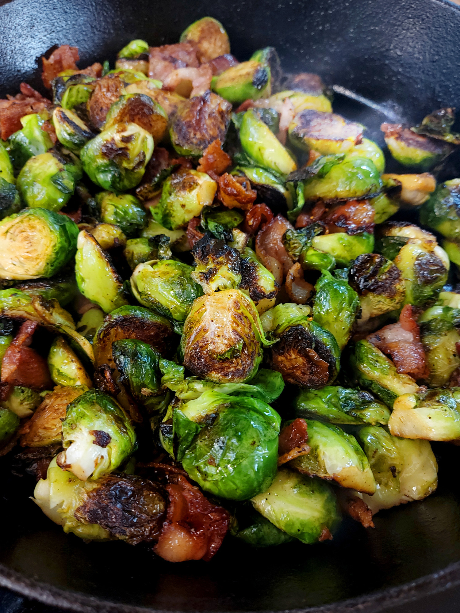 Charred Brussels sprouts with bacon in cast iron