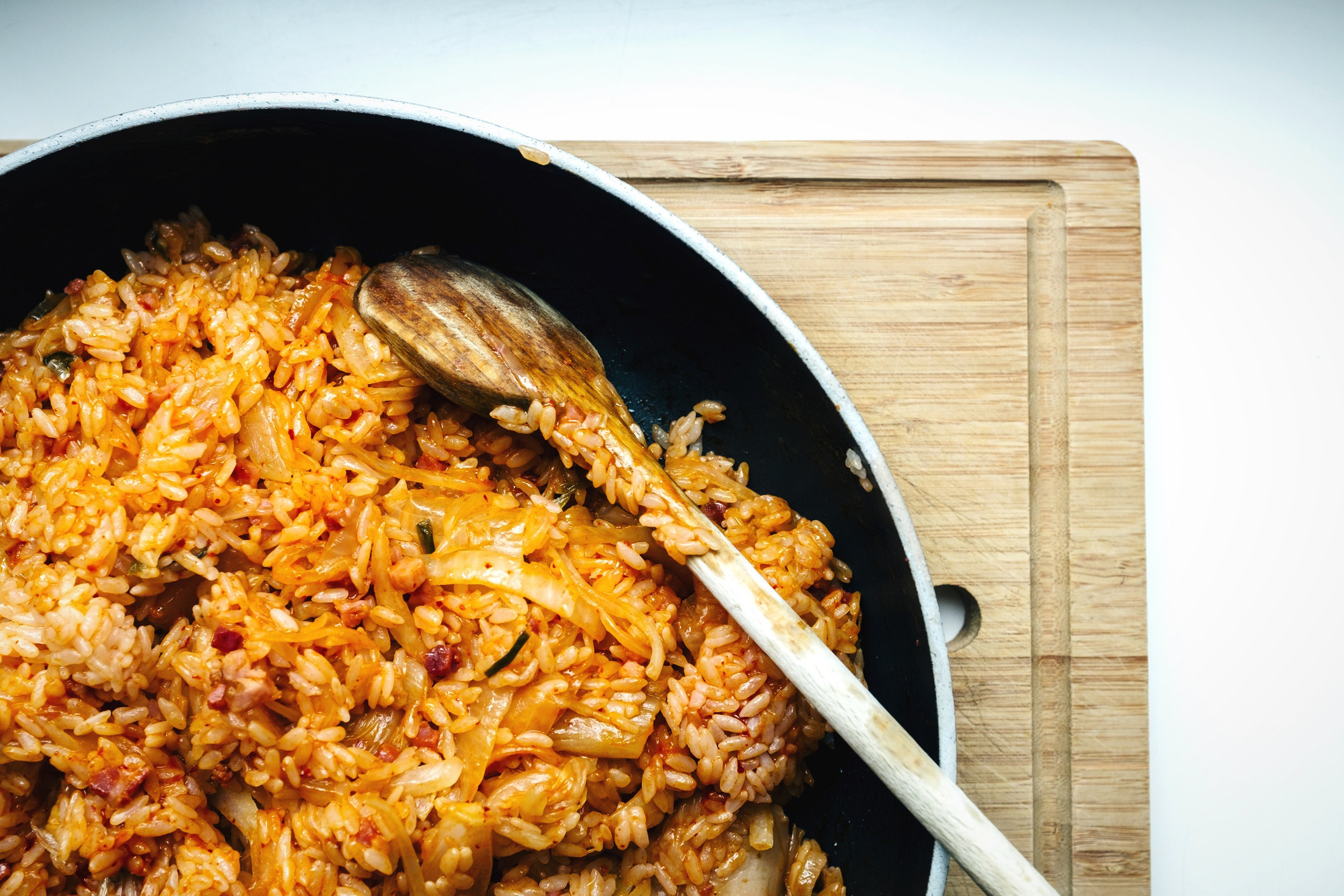 Kimchi fried rice cooking in a pan