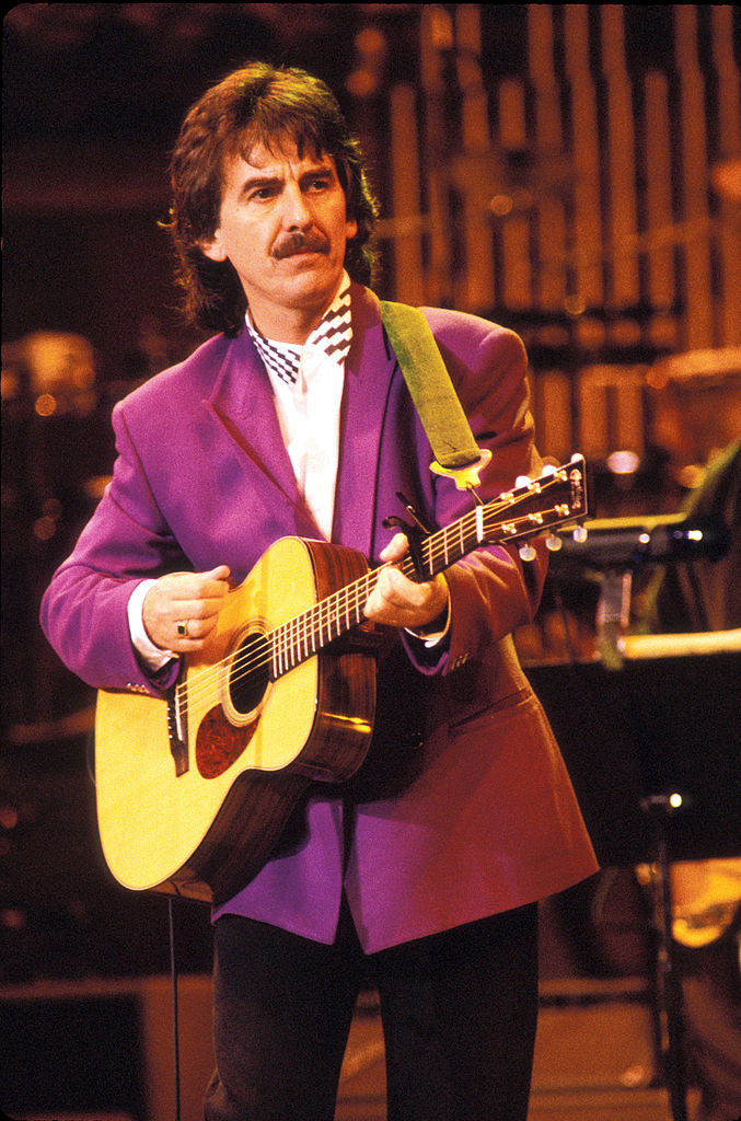 Harrison performing live on stage in 1992