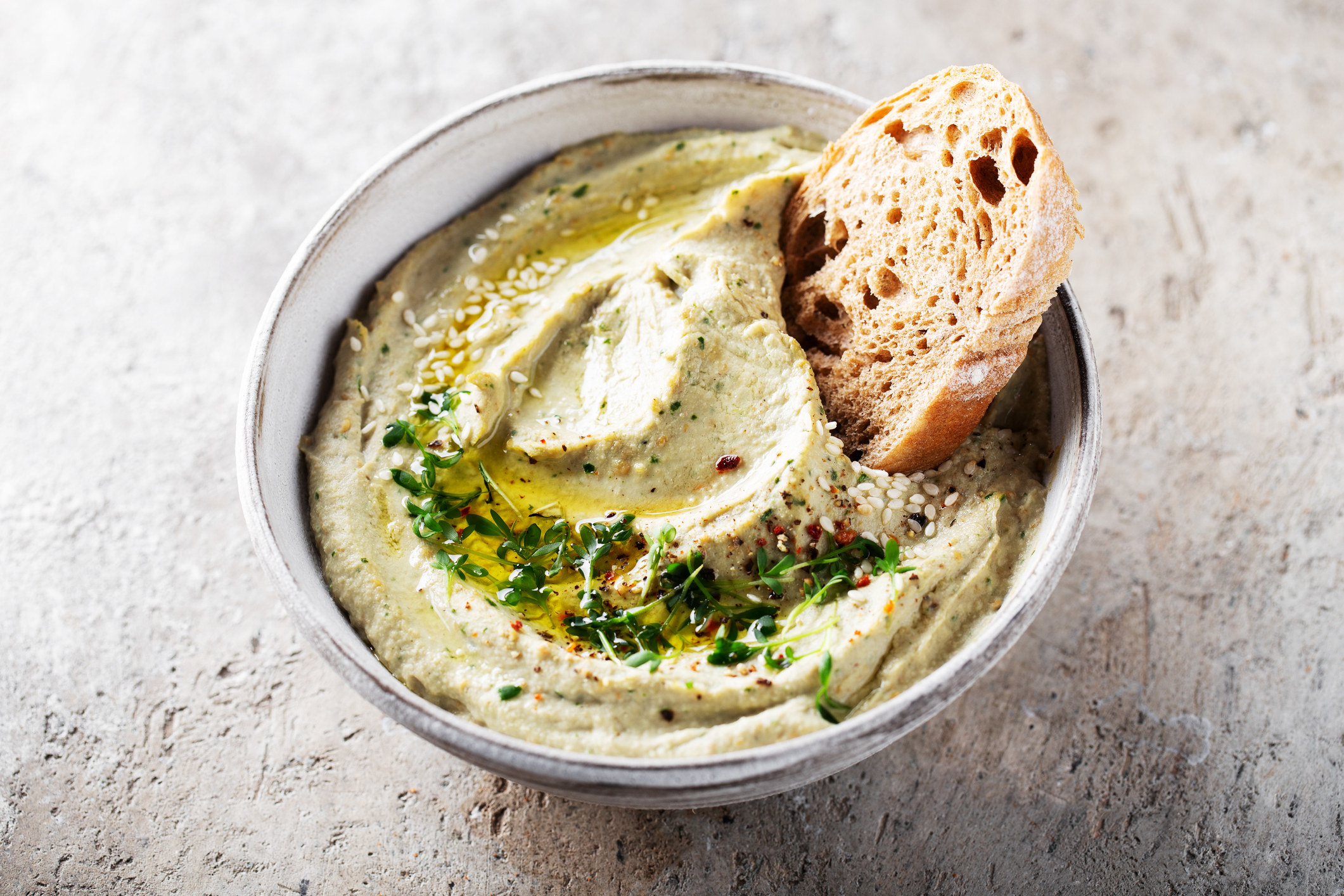 Roasted eggplant dip in a bowl with bread
