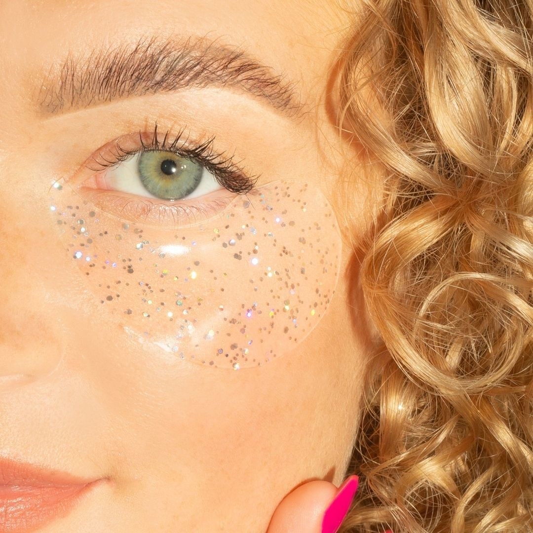 a close up of one of the glittery undereye patches on a person&#x27;s face