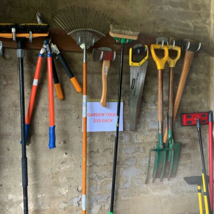 Garden tools for sale at a garage sale