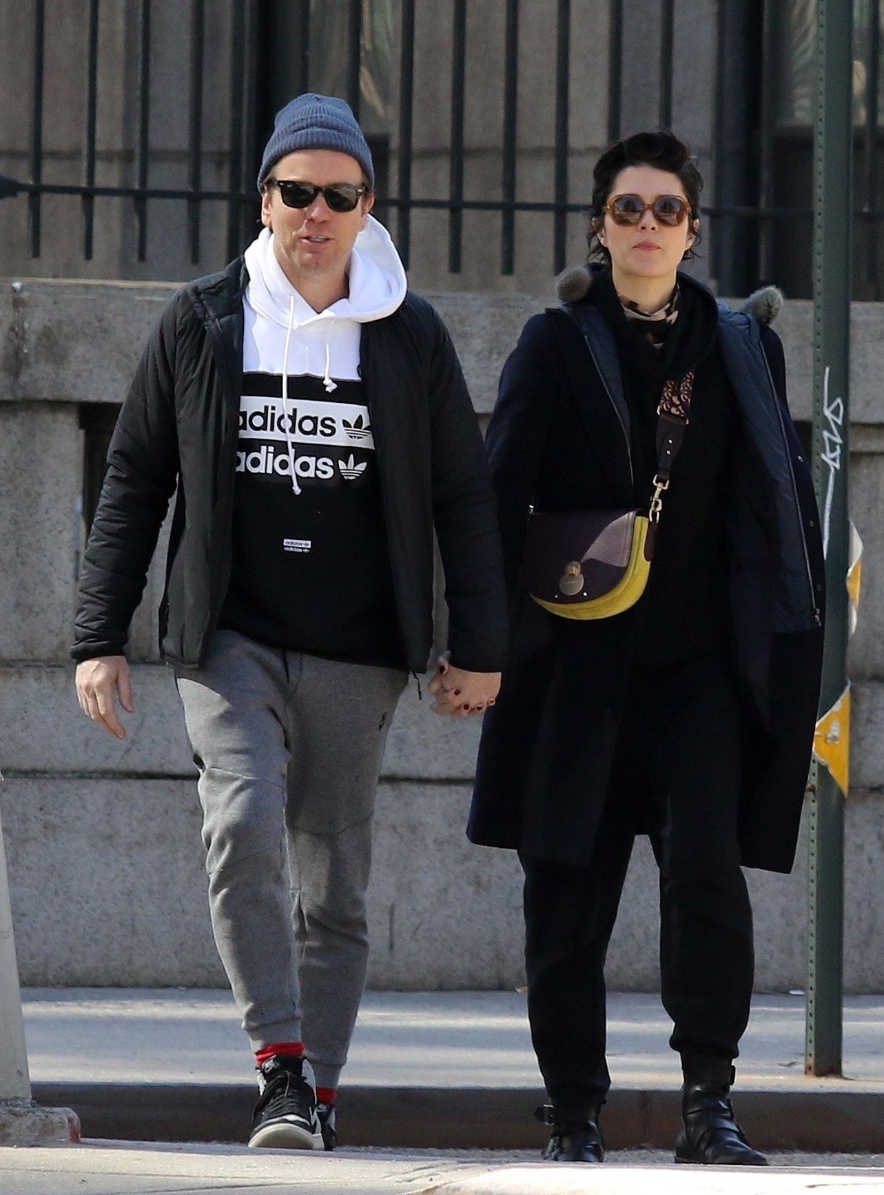 Ewan and Mary walk down the street together