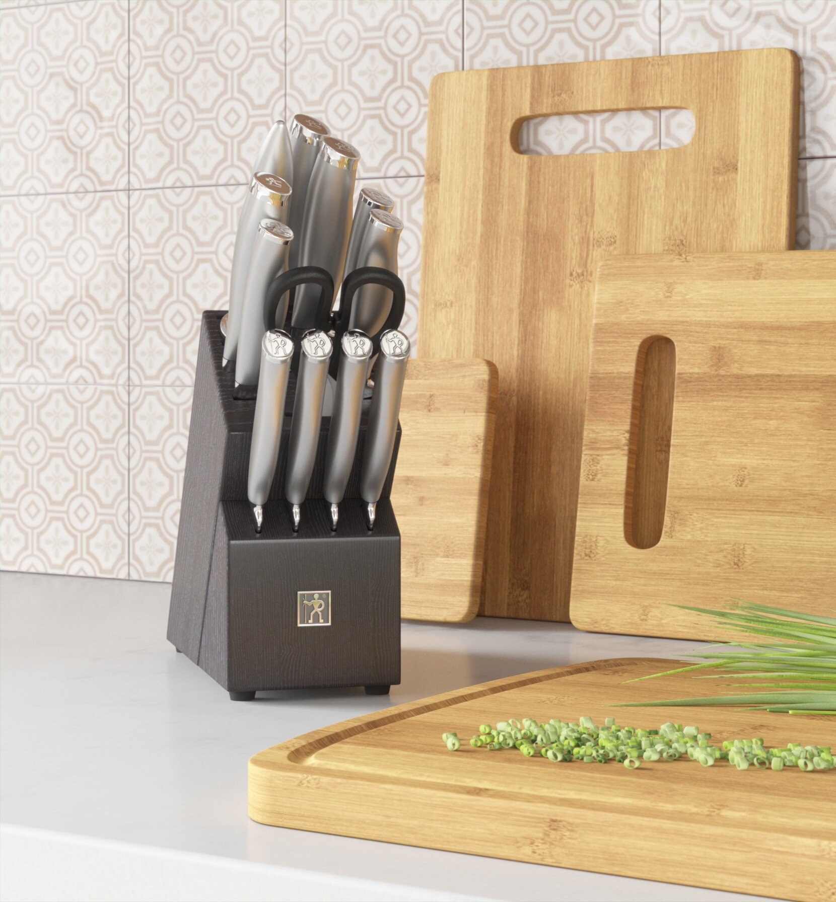 knife set on a kitchen countertop next to cutting boards