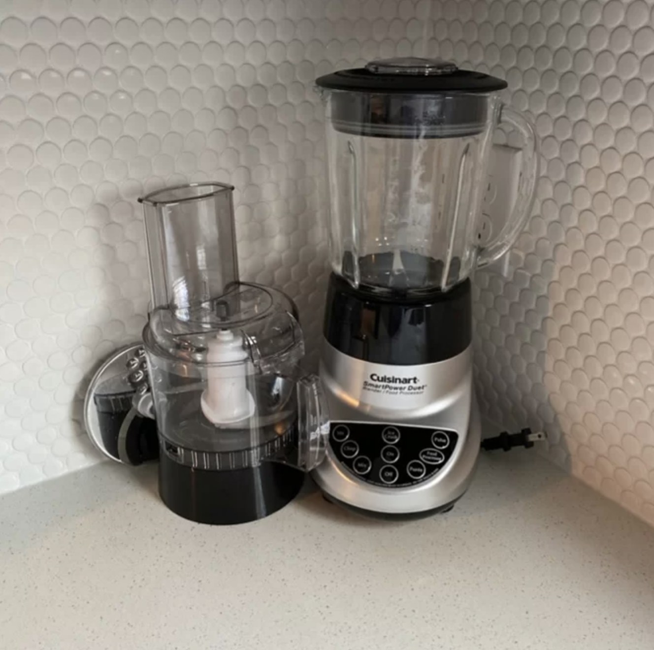 Reviewer&#x27;s photo of the power duet with blender attachment resting on the base and food processor sitting next to it on counter
