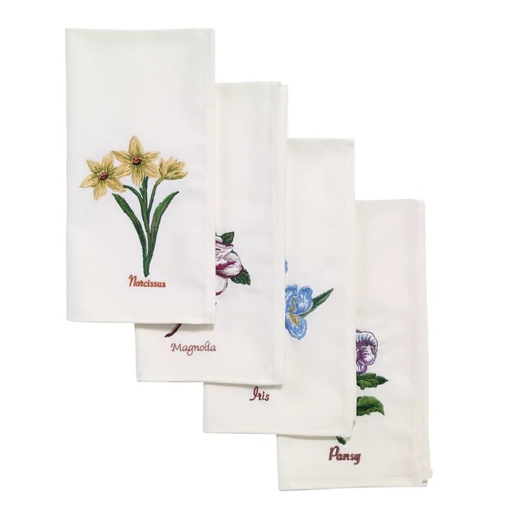 An image of a four embroidered floral napkins