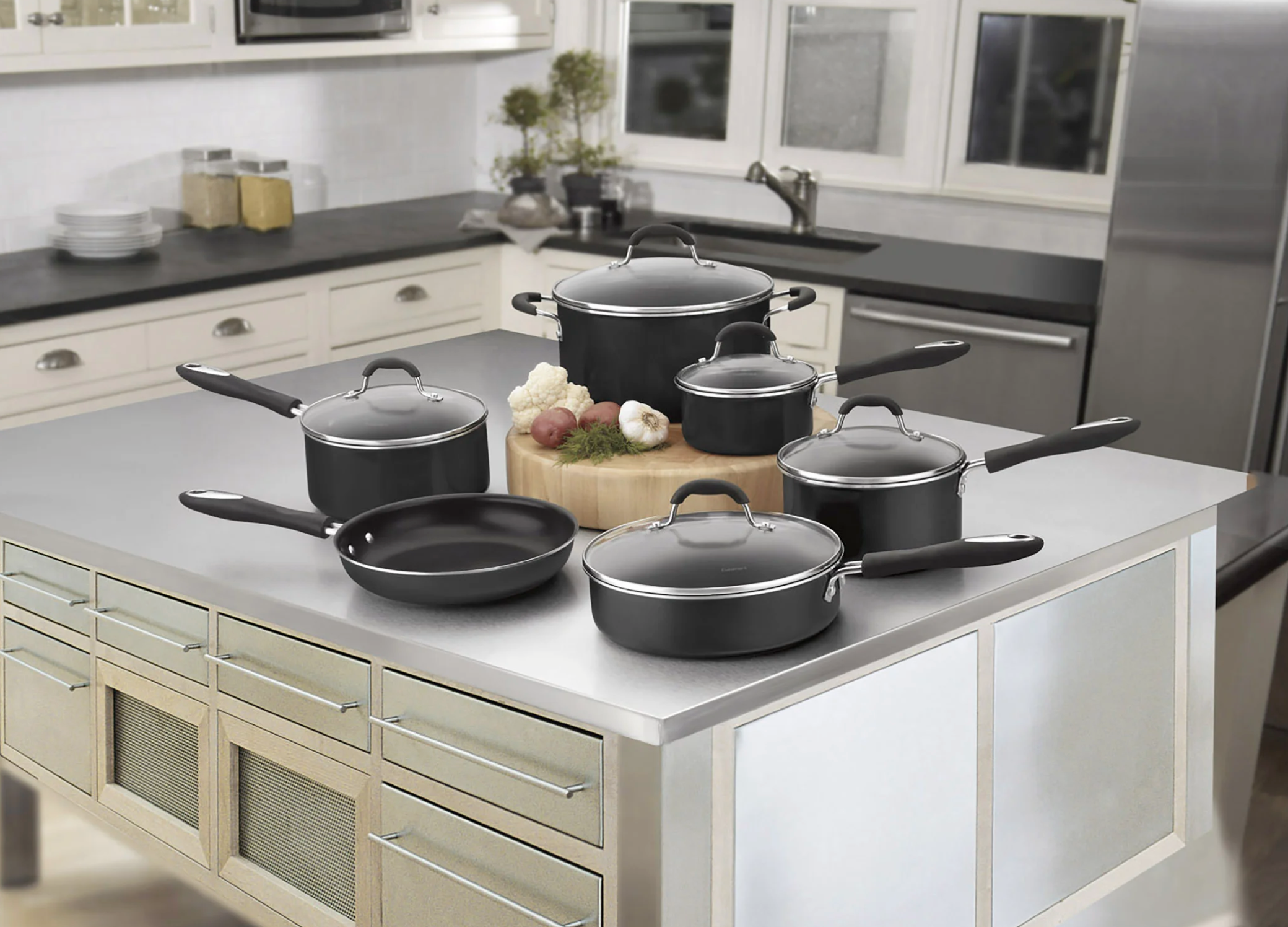 The cookware on a kitchen island in a modern kitchen