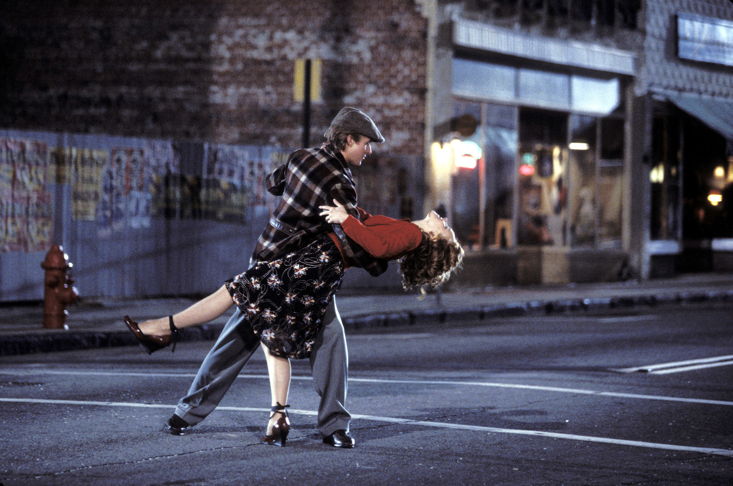 Noah dipping Allie as they dance in the middle of the street
