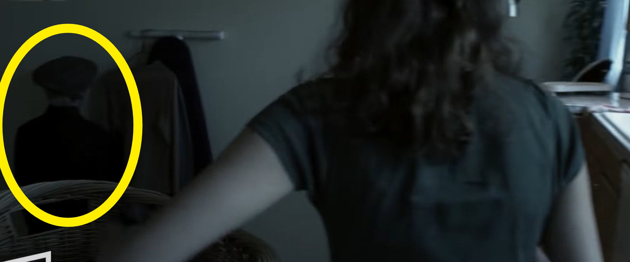 Renai putting laundry into a basket in &quot;Insidious&quot;