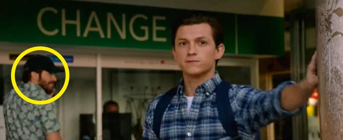 Peter standing next to a pillar with Quentin Beck in the background in &quot;Spider-Man: Far From Home&quot;