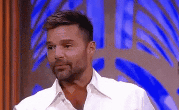 Ricky Martin putting his hand to his mouth and saying, &quot;no&quot;