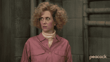 Kristen Wiig in character making a &quot;yikes&quot; expression