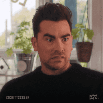 David from Schitt&#x27;s Creek indicating to the side with his eyes