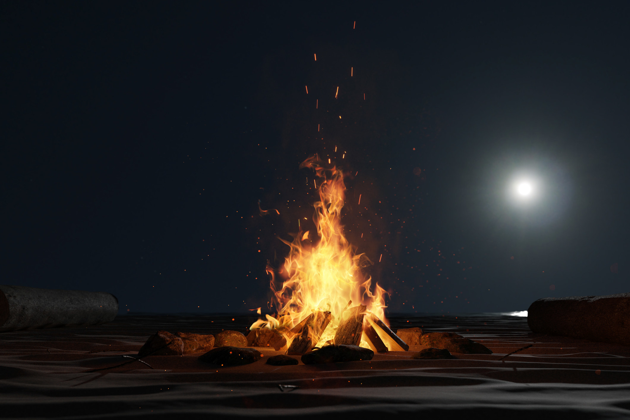 A bonfire burns on the beach