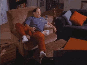a gif of George on a chair with soda and snacks