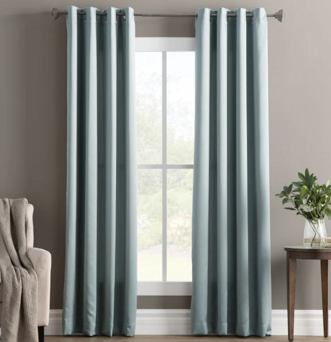 A set of the curtains on a window in a room