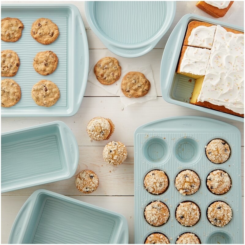 the light blue bakeware with various baked goods