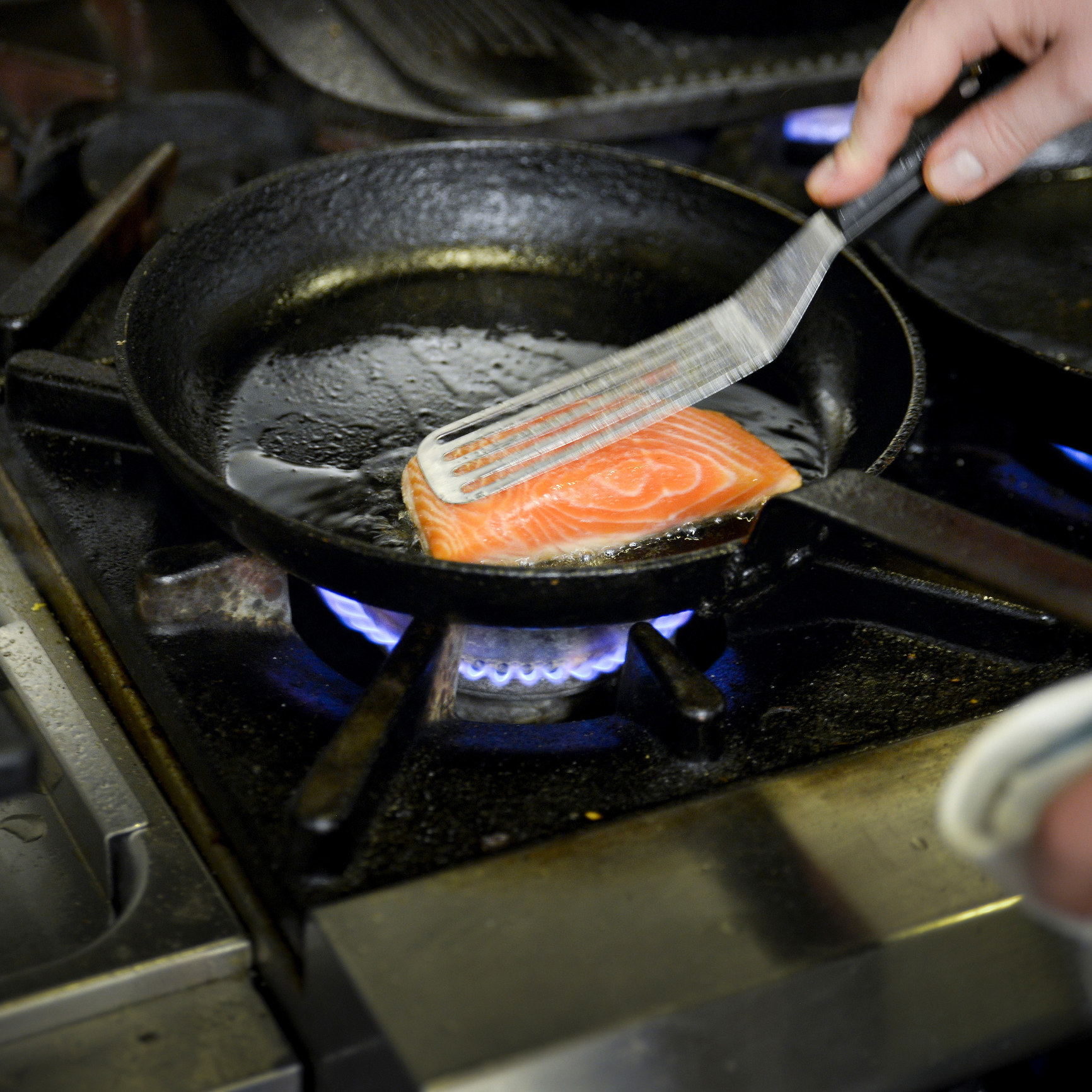 Searing salmon steak on the stove