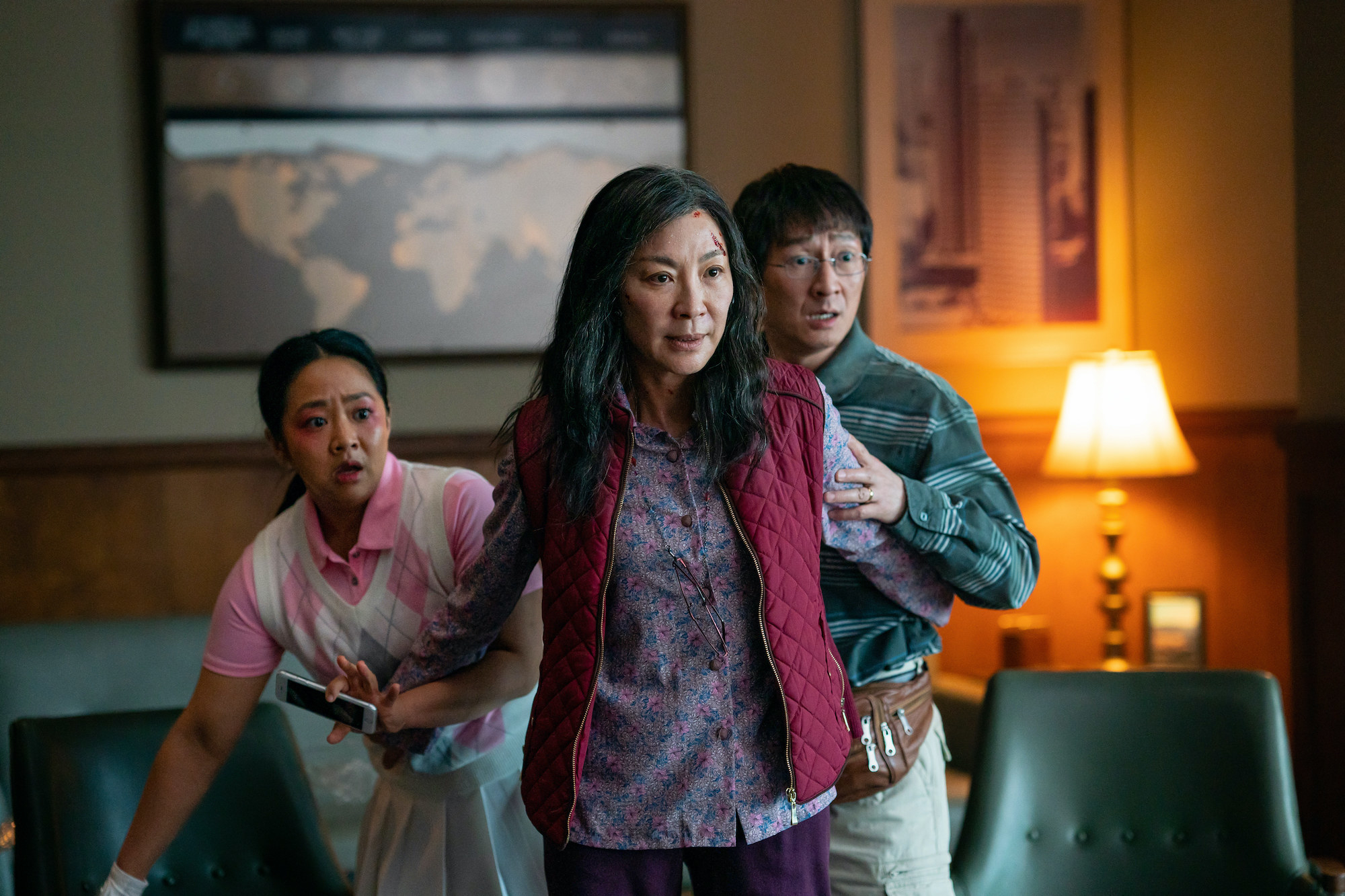 Stephanie Hsu as Joy, Michelle Yeoh as Evelyn, and Ke Huy Quan as Waymond in Everything Everywhere All at Once