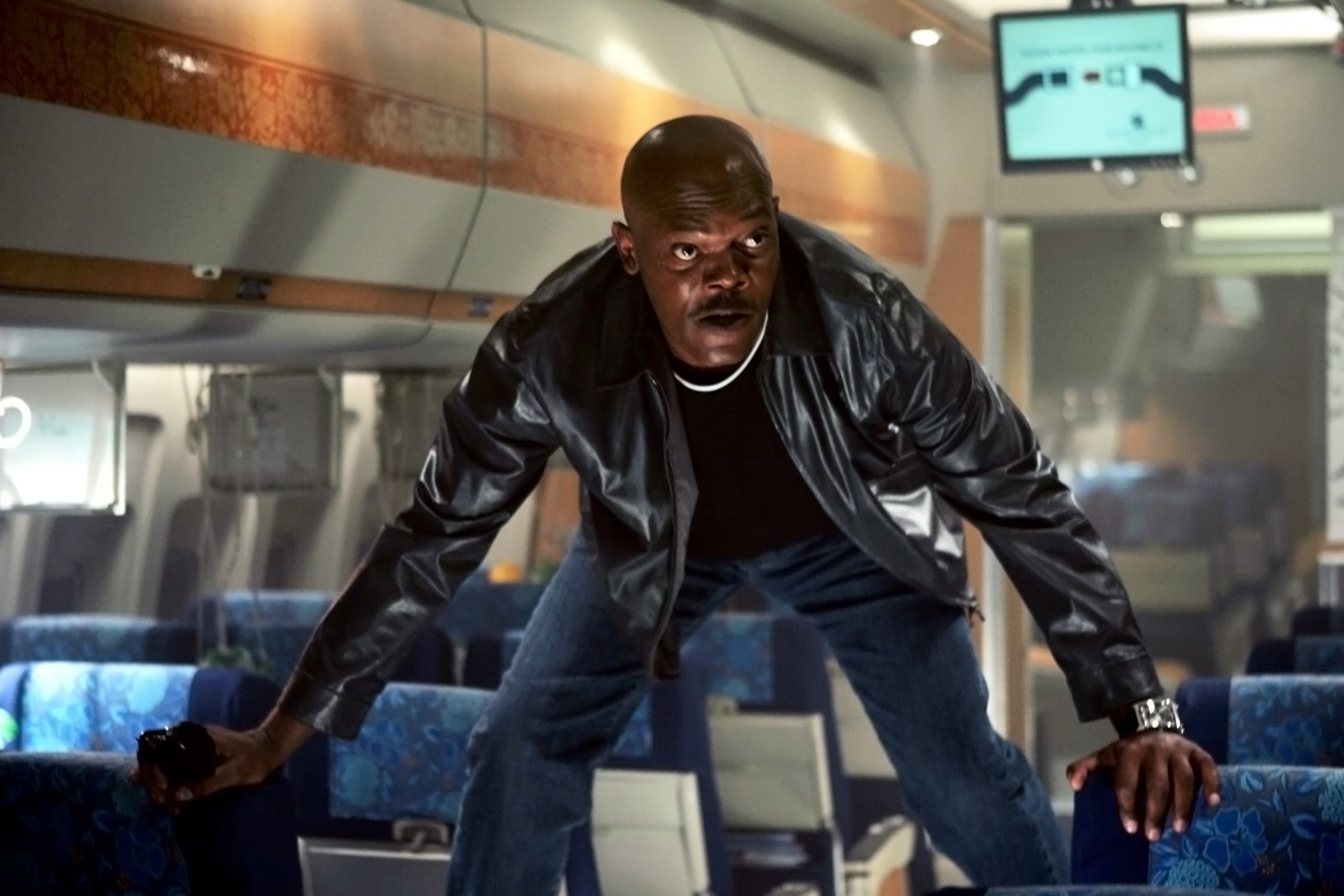 Jackson&#x27;s character standing on the plane&#x27;s seats