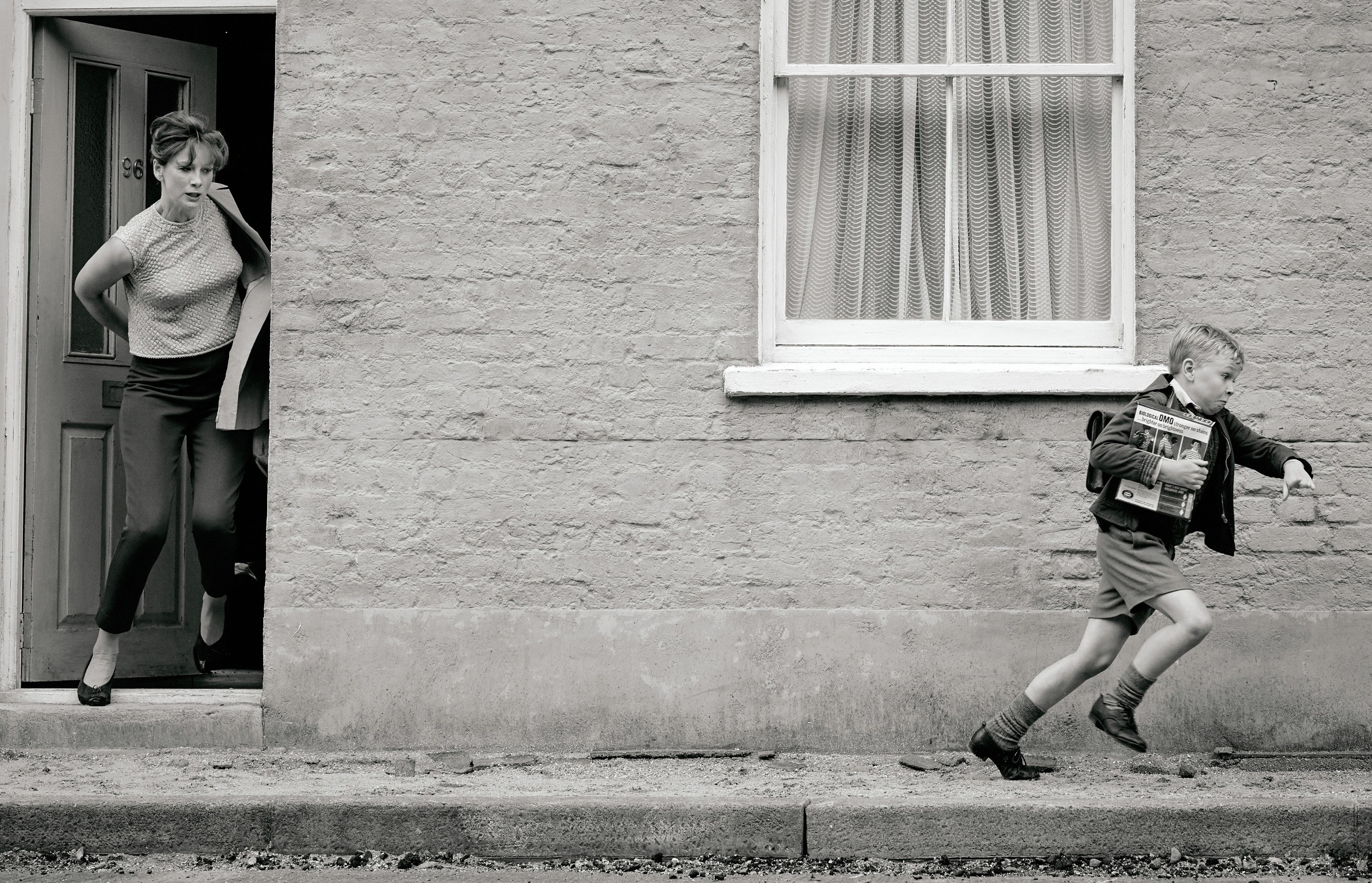 Caitriona Balfe chases Jude Hill down a street