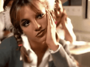Britney Spears with pigtails gazing off into space