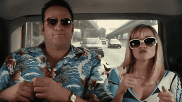 a gif of Vince Vaughn and Reese Witherspoon in the movie &quot;Four Christmases&quot; dancing in the back of a car