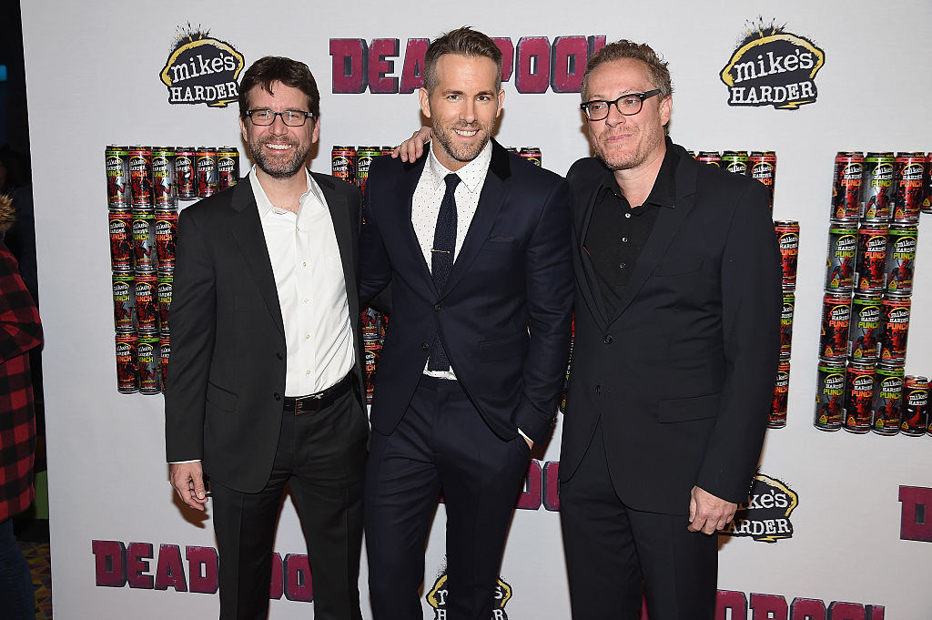 Ryan Reynolds in the middle of the Deadpool producers during an event