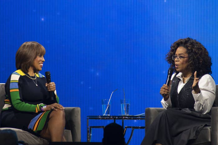 Oprah and Gayle sit while talking at an event