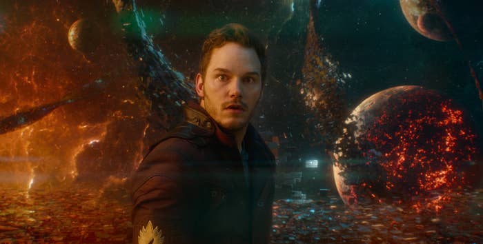 Chris looks in shock with collapsing stars behind him