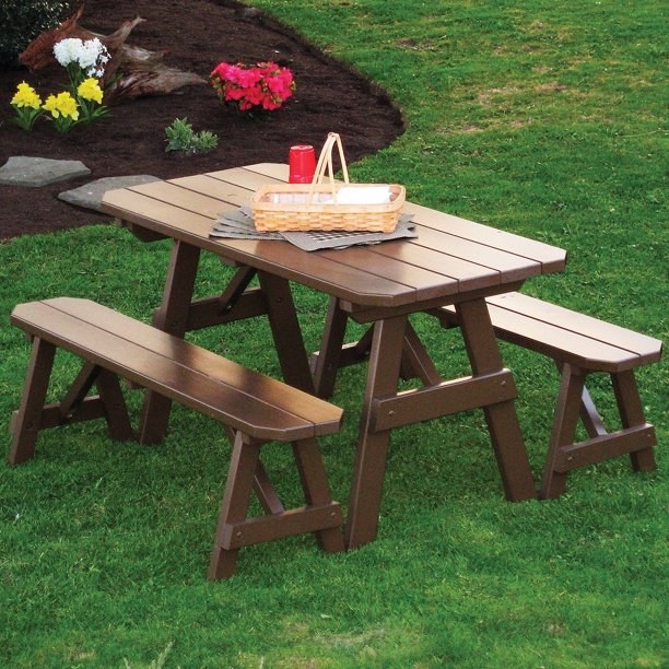 the brown picnic table and benches