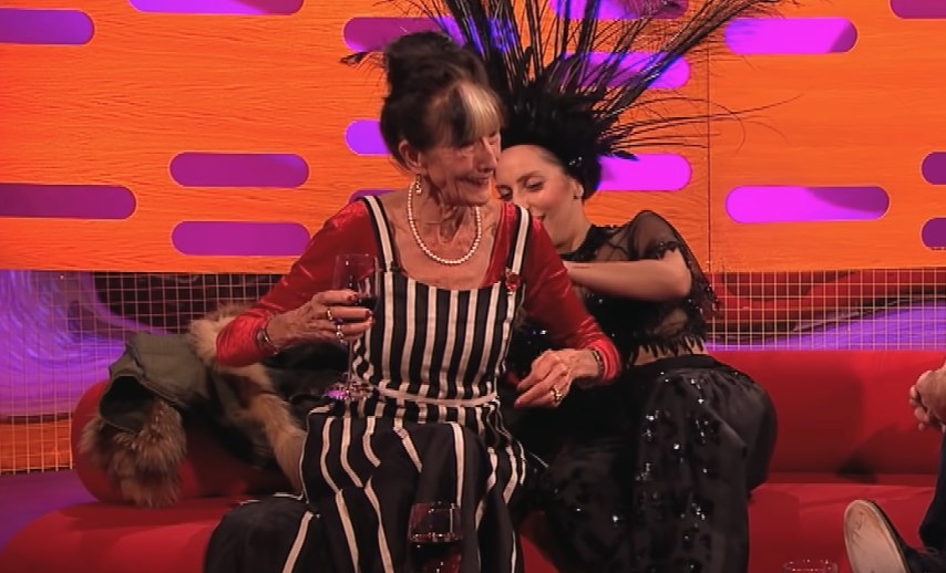 Lady Gaga fixing June Brown&#x27;s outfit from behind