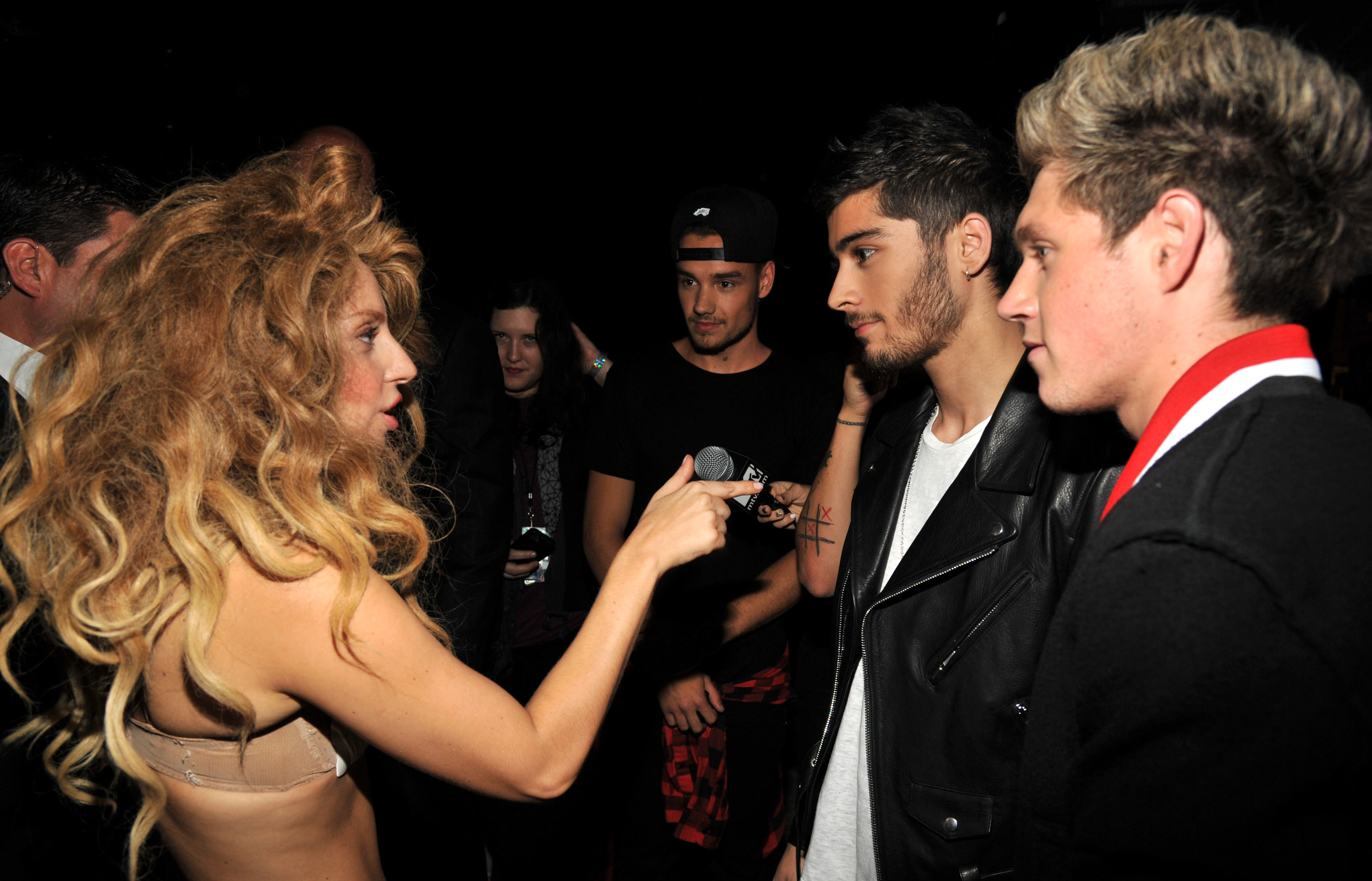 Lady Gaga talking to the One Direction group members