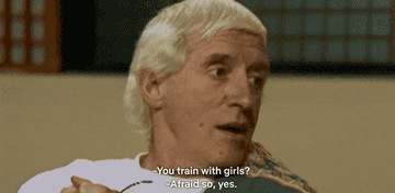 A GIF of Jimmy Savile and Selina Scott in a sit-down interview