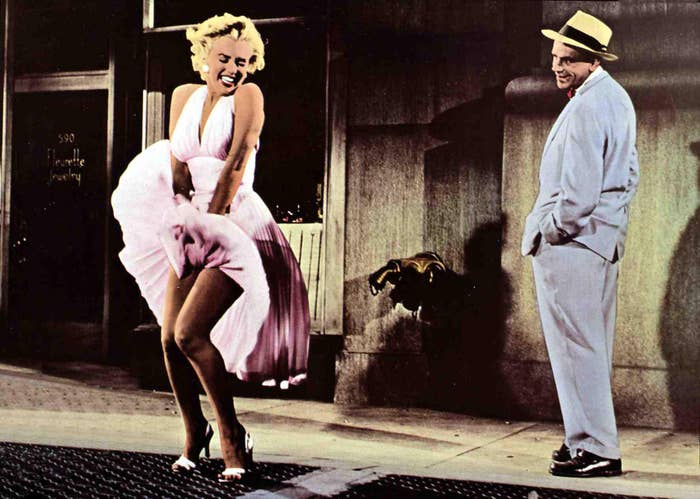 Marilyn Monroe poses over a grate which blows her dress up. The scene is from the movie &quot;The Seven Year Itch&quot;