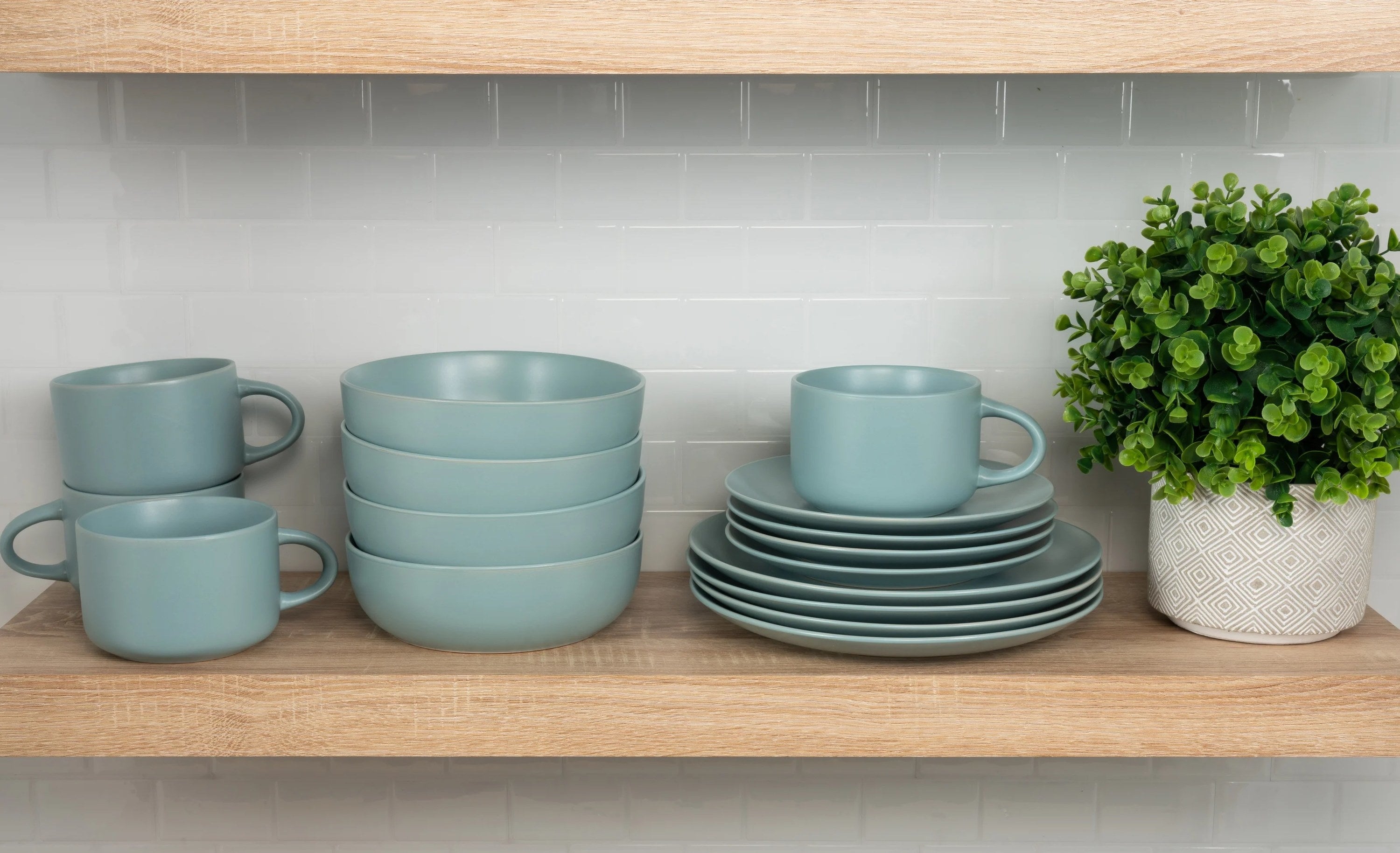 blue dinnerware set on a wooden shelf