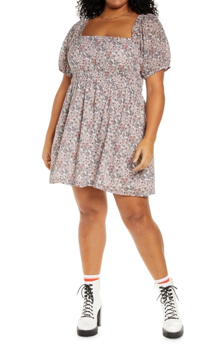 model wearing a floral short puff sleeve cotton prairie dress