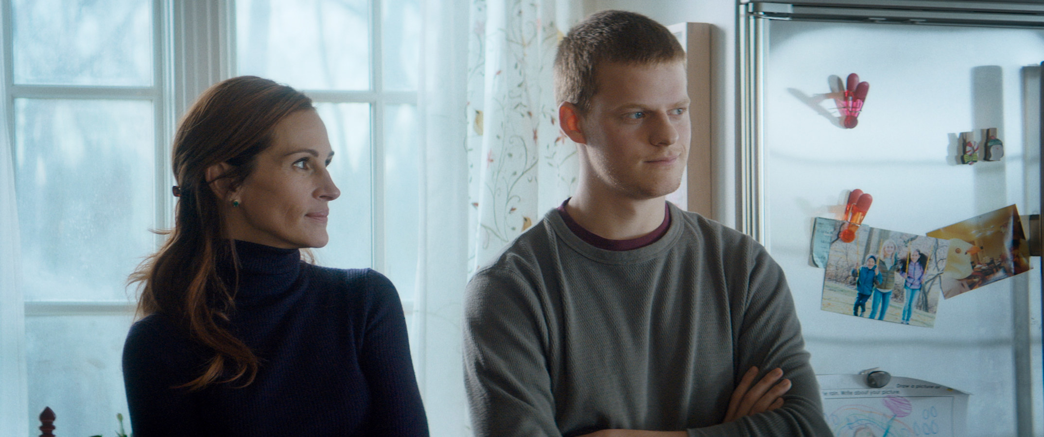 Julia Roberts and Lucas Hedges stand in a kitchen