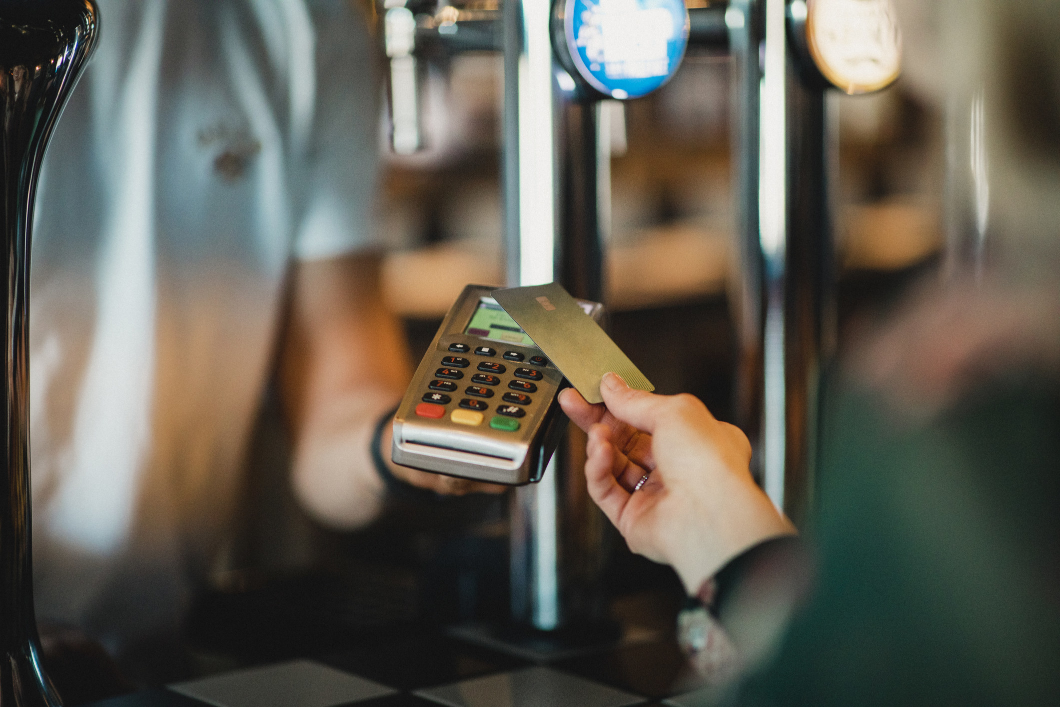 Paying with a card at a bar.