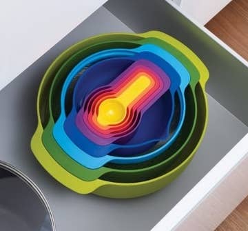 the rainbow bowl and measuring cup set in a drawer