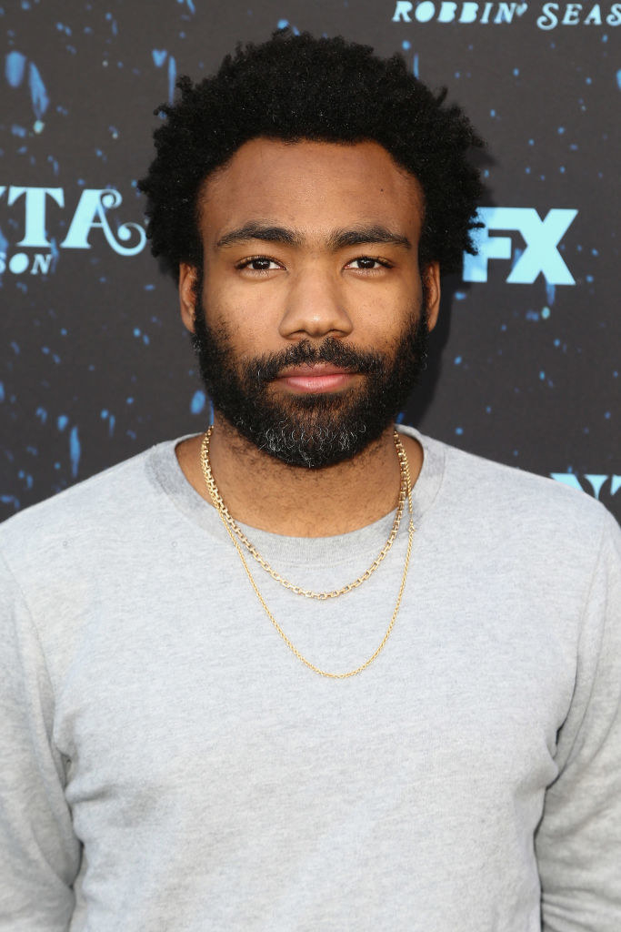 Donald with thick beard and mustache, wearing a sweatshirt
