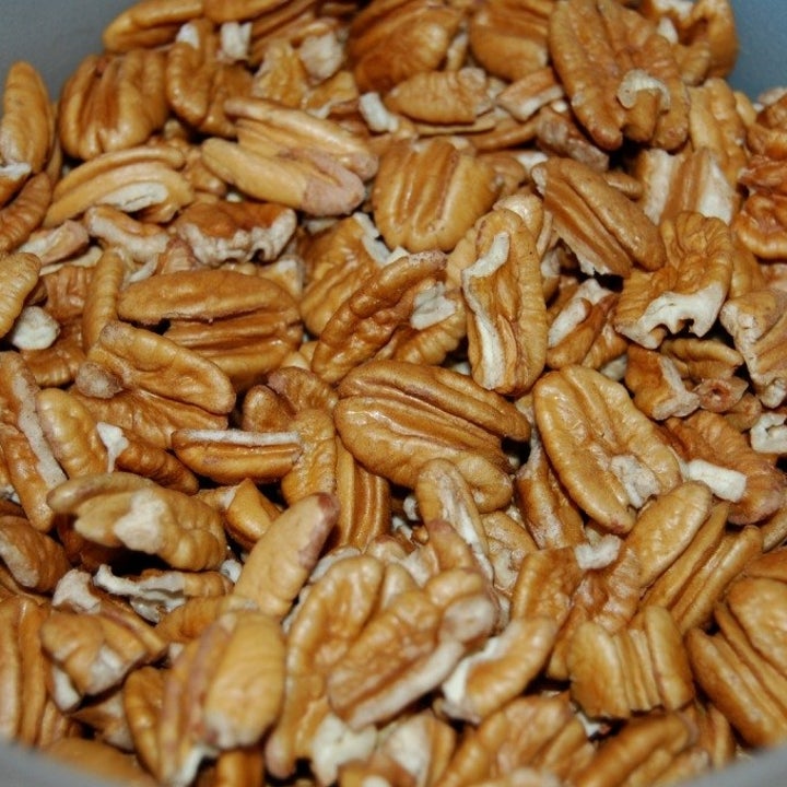 A close up of pecans in a bowl