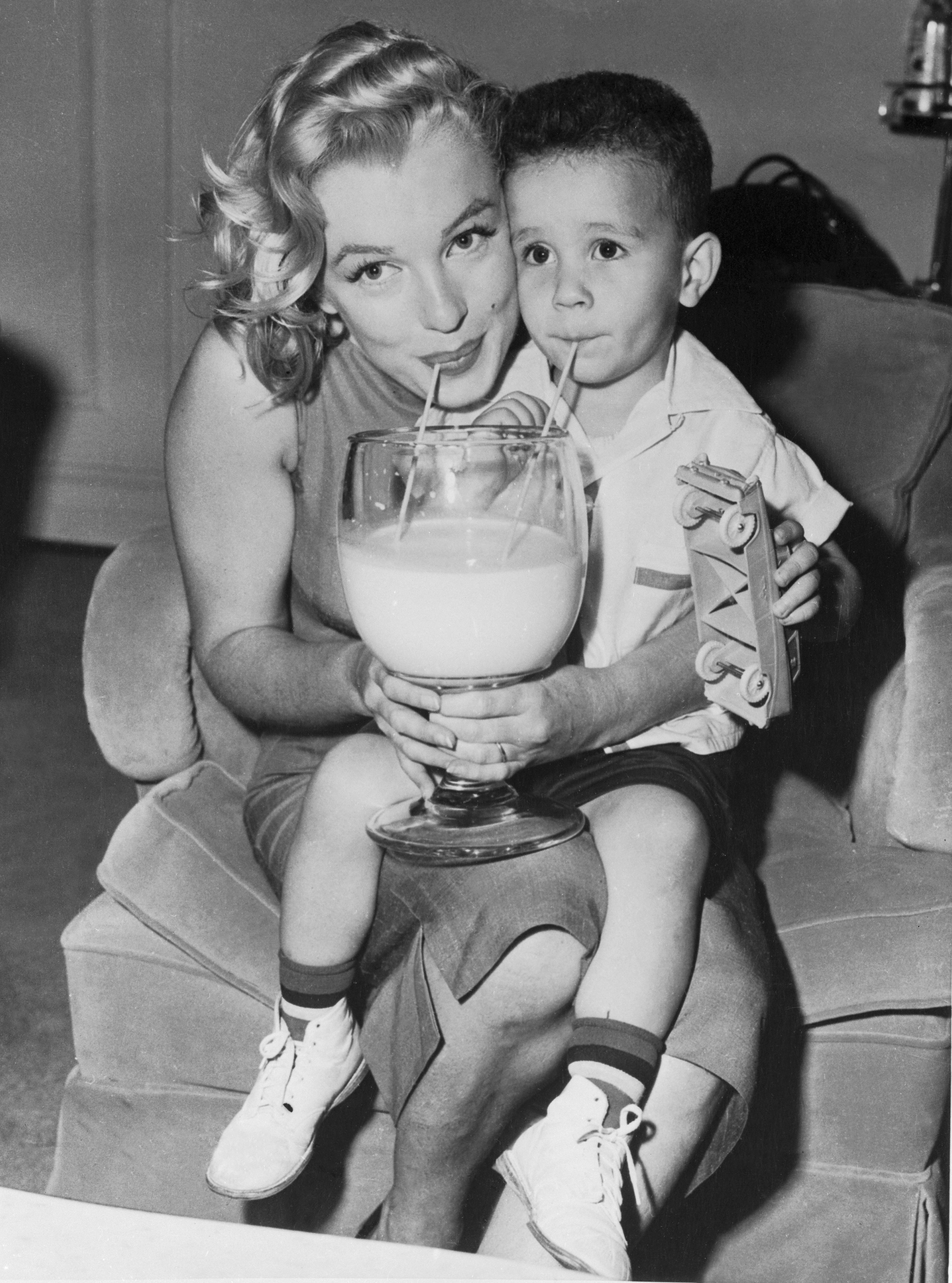Marilyn Monroe sips milk with William Metzler, who was a Milk Fund beneficiary