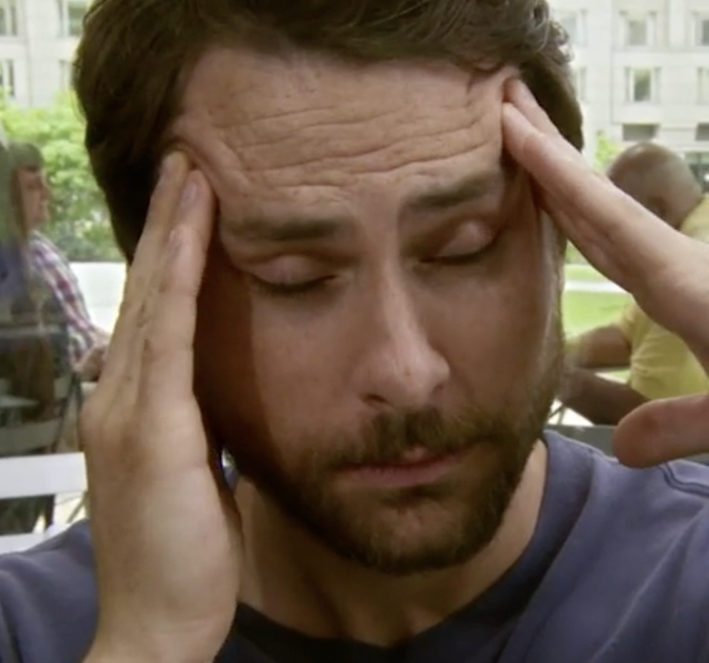 Charlie from It&#x27;s Always Sunny in Philadelphia rubbing his temples from a headache