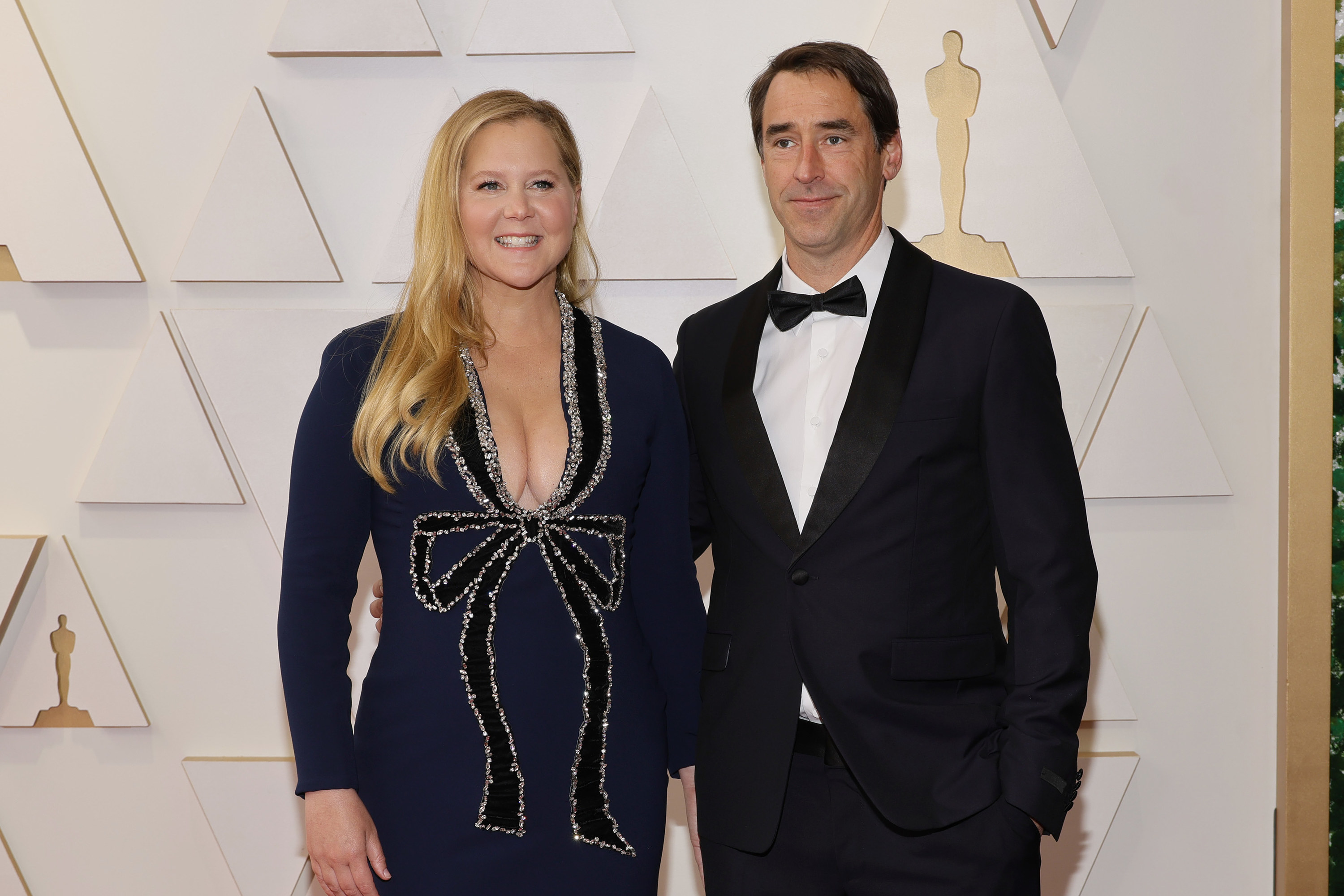 Amy Schumer and Chris Fischer attend the 94th Annual Academy Awards