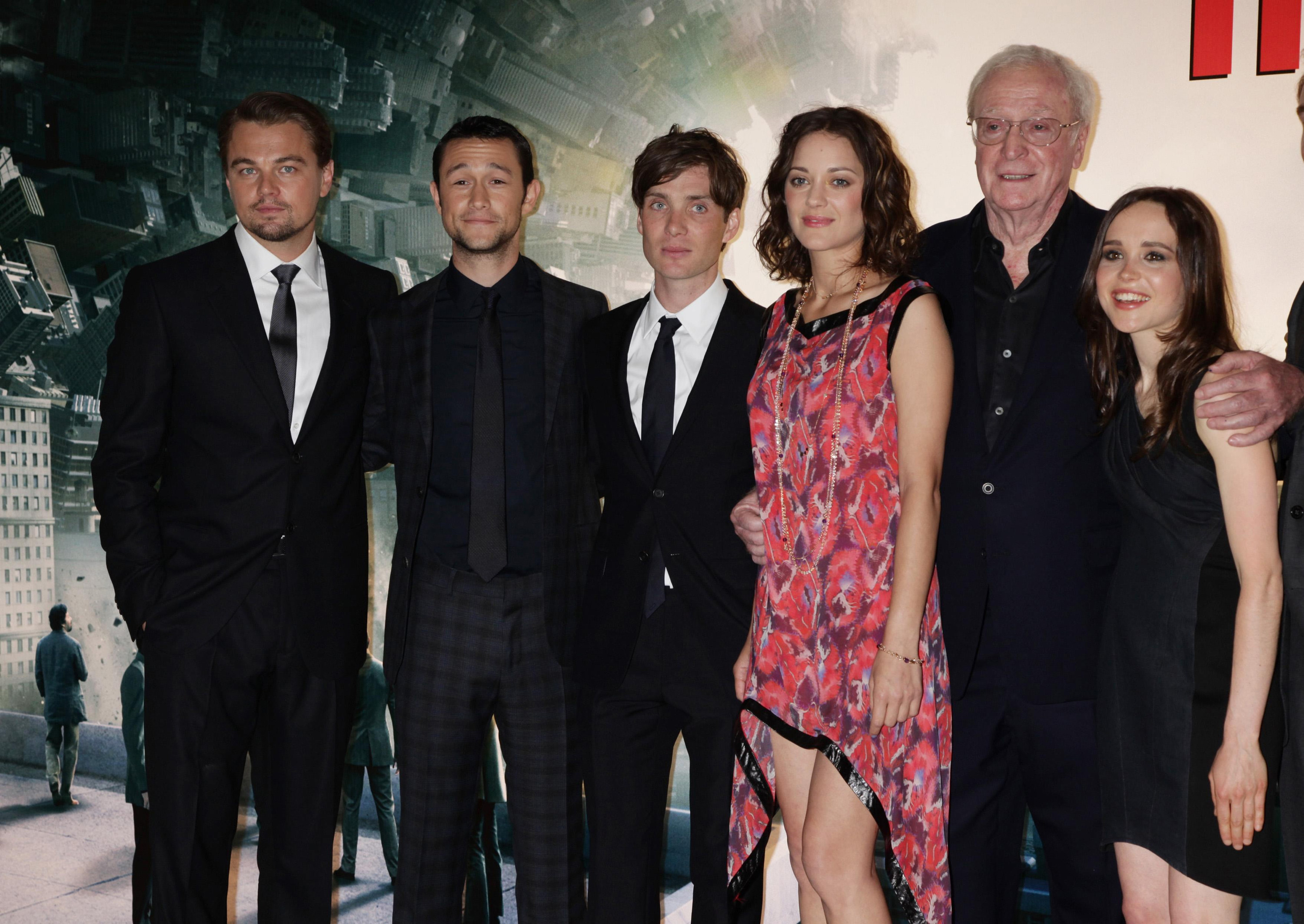 The main characters of Inception standing at a film showing
