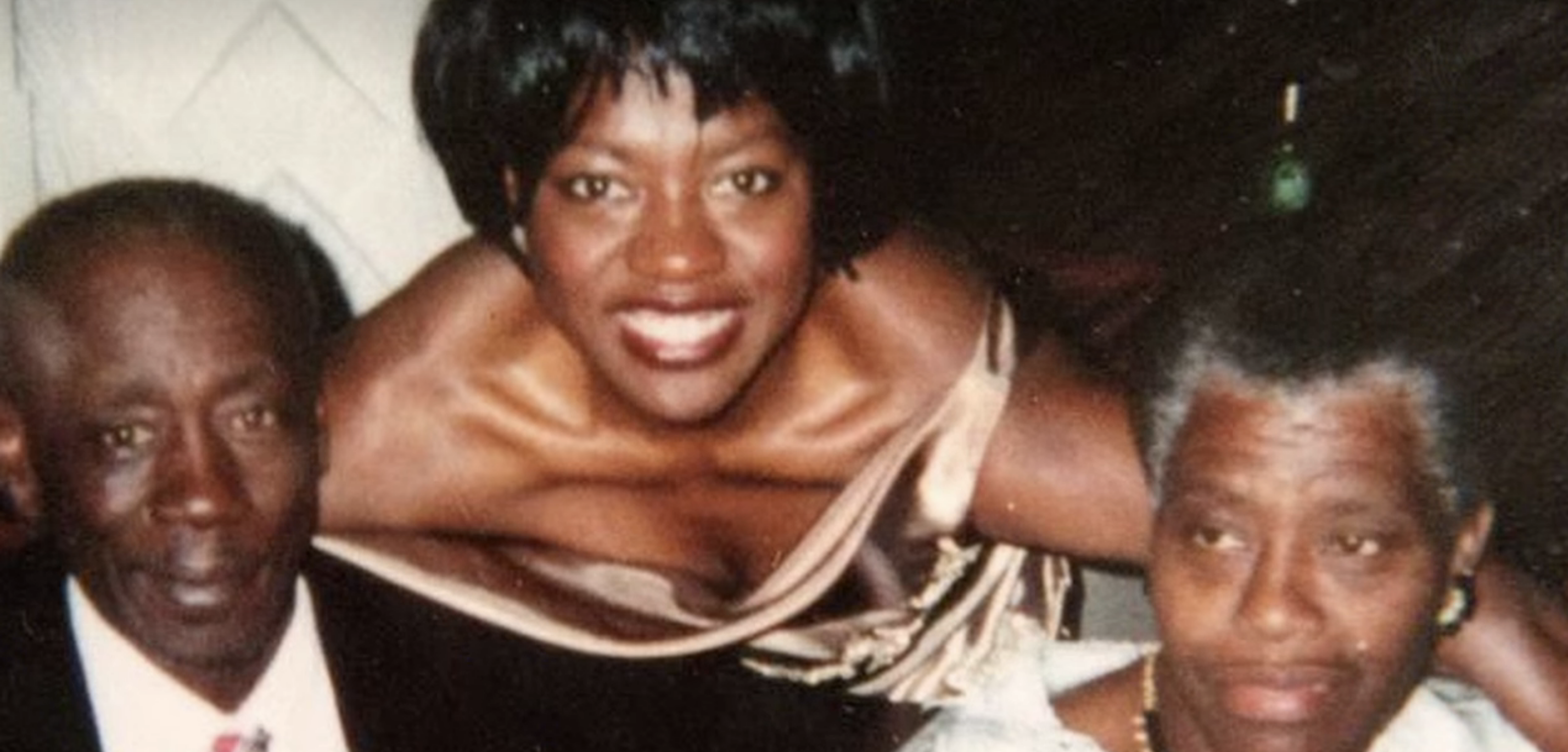 Viola Davis is pictured in the middle while her father is on her left, and her mother on the right