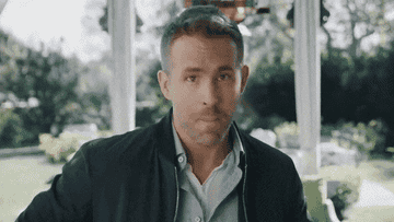 Ryan Reynolds winking and then shaking his head